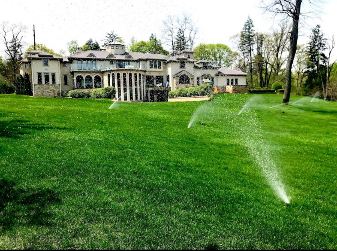 Luxury mansion with full sprinkler system running in Farmington Hills, Michigan — Elite Sprinkler Systems